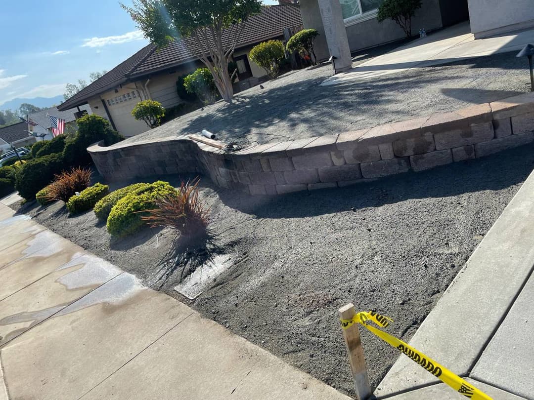 picture of a front yard with pavers and concrete being poured in san diego california