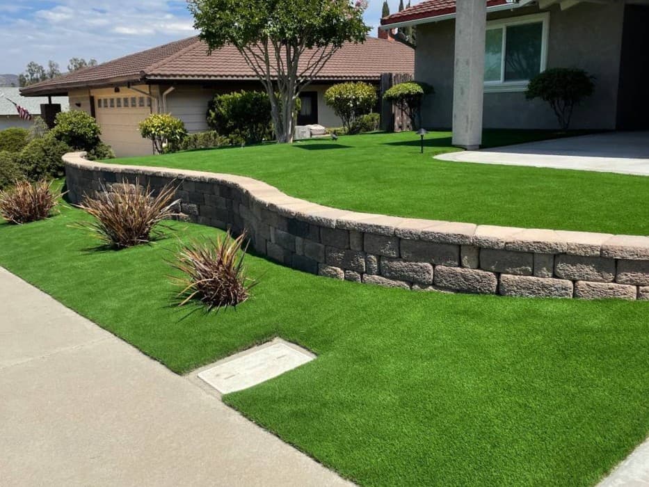 picture of san diego california residential neighborhood front yard with new retaining wall pavers and artificial turf